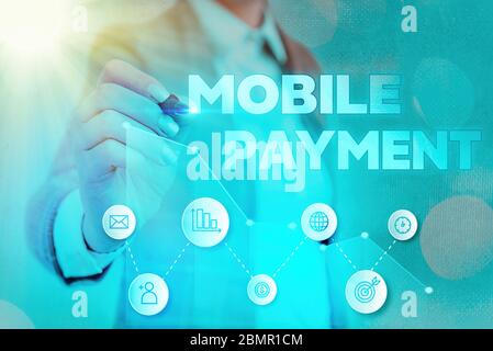 Schreibnotiz mit Mobile Payment. Geschäftskonzept für bargeldlose Zahlung durch tragbare elektronische Geräte Stockfoto