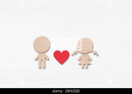 Holzform von Frauen und Männern mit rotem Herz auf weißem Holzhintergrund. Valentinstag Konzept. Stockfoto