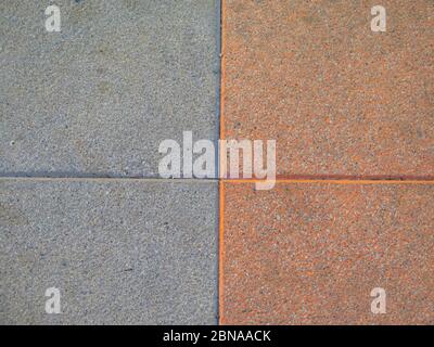 Nahaufnahme der Verbindung zwischen farbigen Betonplatten Stockfoto