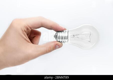 Lampe in der Hand isoliert auf weißem Hintergrund Stockfoto