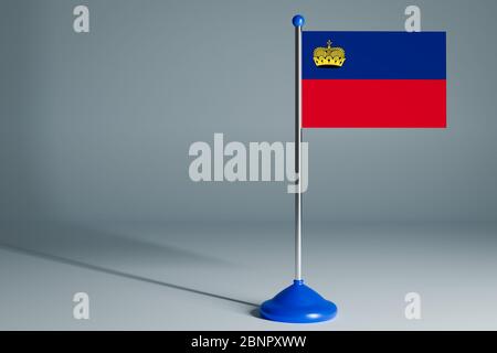 Die 3d-Rendering realistische Landesflagge von Liechtenstein auf Stahlmast auf grau isoliert Hintergrund. Leere Tischflagge , geeignet für Design, Mockup Stockfoto
