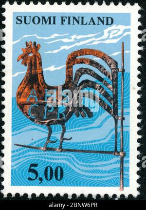 POLTAVA, UKRAINE - 15. Mai 2020. Vintage Stempel gedruckt in Finnland um 1977 zeigen Wetterhahn Stockfoto