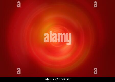 Abstrakte radiale Bewegungsunschärfe auf einem primären dunkelroten Hintergrund mit hellgelben Farben Stockfoto