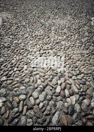 Farbe Bild des Pflasters aus runden Steinen. Stockfoto