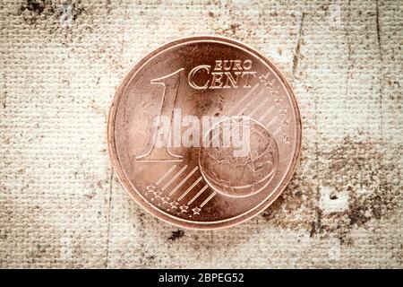 Ein Euro-Cent auf alte Leinwand Hintergrund Stockfoto