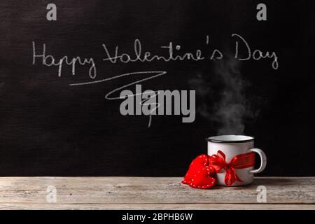 Happy Valentine's Day Text mit weißer Kreide auf den schwarzen Tafel Stockfoto