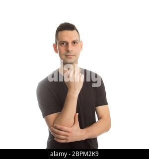 Porträt eines schönen jungen Mannes, der an etwas denkt, Stockfoto