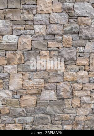 Dekorative und unregelmäßigen Steinmauer. Ideal für Texturen und Hintergründe. Stockfoto