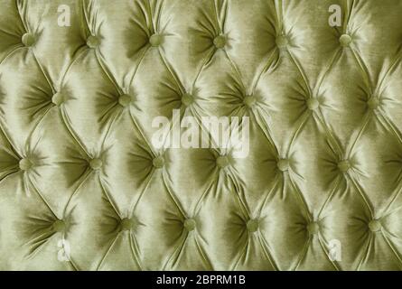 Pastell Green Velvet capitone Background, retro Chesterfield Stil kariert Soft getuftete Stoffmöbel Rautenmuster Dekoration mit BUTTO Stockfoto