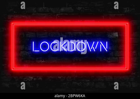 Lockdown Neon Schild auf einem dunklen Backstein Hintergrund Stockfoto