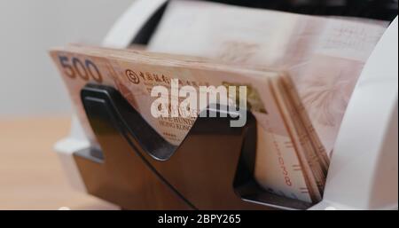 Geldzählmaschine für Hong Kong Dollar Stockfoto