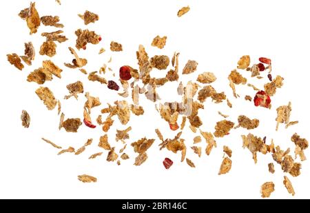 Fallende Cornflakes und Obst auf weißem Hintergrund Stockfoto