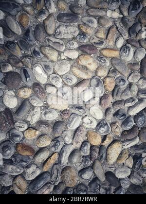 Farbe Bild des Pflasters aus runden Steinen. Stockfoto