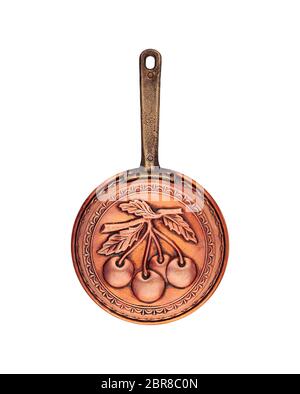 Vintage Kupfer Pfanne mit einem zum Backen graviert cherry Beeren Griff isoliert Stockfoto