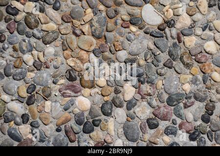 Hintergrund Textur der Pflaster Pellets. Kieselsteine in Beton. Stockfoto