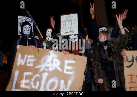 Auf dem "Millionen-Maske-Marsch" werden Proteste mit V-for-Vendetta-Stil Guy Fawkes Masken und Demonstrationen gegen Austerität, die Verletzung ziviler ri Stockfoto