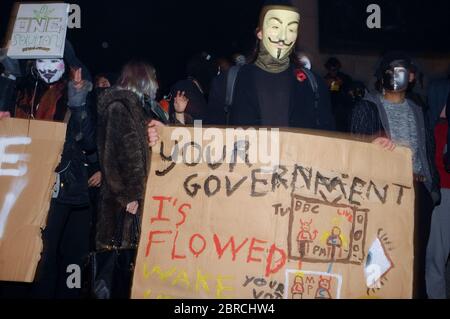 Auf dem "Millionen-Maske-Marsch" werden Proteste mit V-for-Vendetta-Stil Guy Fawkes Masken und Demonstrationen gegen Austerität, die Verletzung ziviler ri Stockfoto