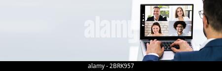 Mann, Der Von Zu Hause Aus Arbeitet, Hat Eine Online-Videokonferenz Der Gruppe Auf Dem Laptop Stockfoto