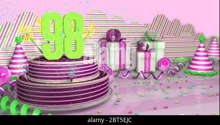 Lila rund 98 Geburtstagskuchen mit bunten Funken und rosa Linien auf einem hellen Tisch mit grünen Streamer, Party Hüte und Geschenkboxen mit Stift verziert Stockfoto