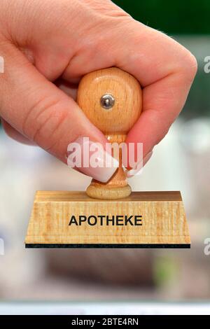 Hand mit Stempel Schriftzug Apotheke, Apotheke Stockfoto