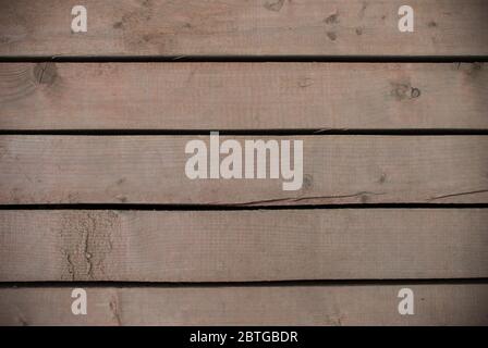 Braune Holzbretter mit Löchern zwischen ihnen Textur. Hintergrund für Design Stockfoto