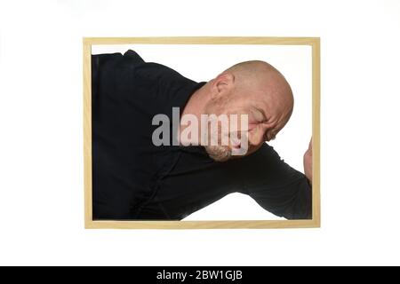 Mann in einem Rahmen eingesperrt Stockfoto