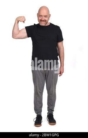 Mann mittleren Alters, der Bizeps macht Stockfoto