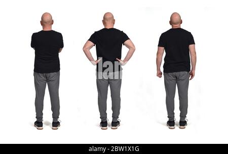 Verschiedene Rückenhaltungen eines kahlen Mannes, der Sportbekleidung trägt Stockfoto