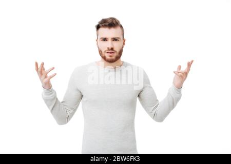 Beschämt und verwirrt junger Mann zeigt, warum Handbewegung über weißem Hintergrund Stockfoto
