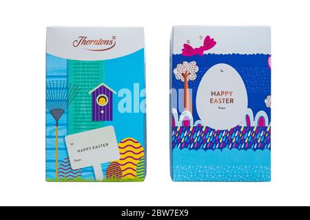 Thorntons Happy Easter - Thorntons Vollmilchschokolade Einhorn Osterei & Thorntons weiße Schokolade Bunny Egg Boxen Stockfoto