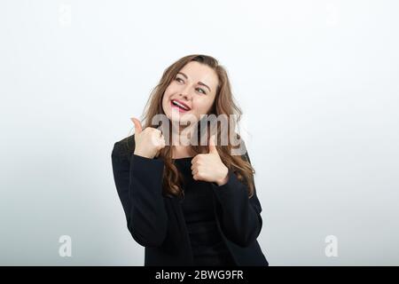 Glücklich Weibliches Lächeln Hielt Daumen Finger. Gut, Erfolgreiche Person, Guten Tag Stockfoto