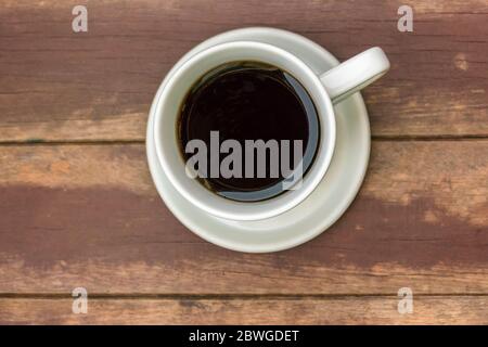Tasse Kaffee auf Holztisch Blick Stockfoto