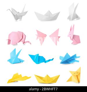 Viele Origami-Figuren auf weißem Hintergrund Stockfoto