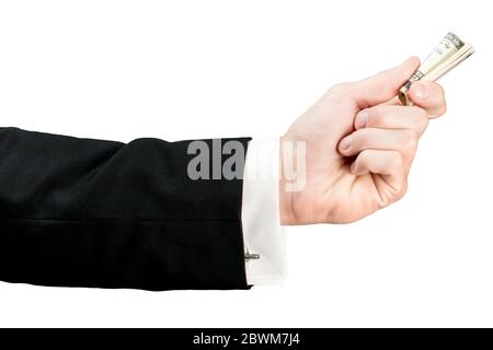 Die Hand eines respektablen Mannes hält Dollar in einem Stroh aufgerollt. Isoliert Stockfoto