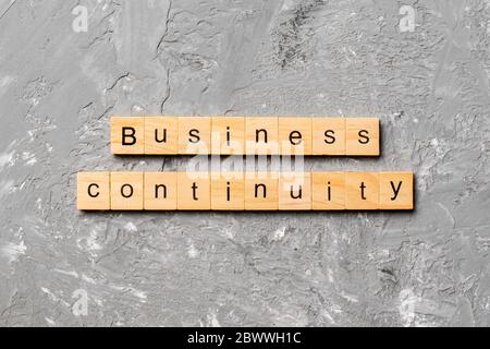 Business Continuity Wort auf Holzblock geschrieben. Business Continuity Text auf Zementtisch für Ihr Design, Konzept. Stockfoto