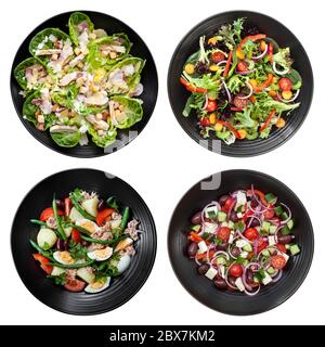 Set von verschiedenen Salaten auf weißem Hintergrund. Enthält Huhn caesar, Garten, Nicoise und Griechisch. Stockfoto