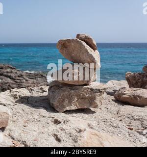 Steinstatue an der Cap de ses salines Stockfoto