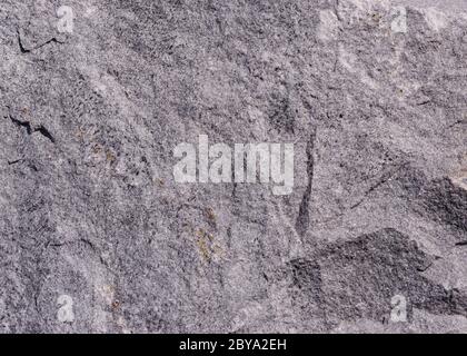 Struktur eines gerissenen braunen Steins Stockfoto