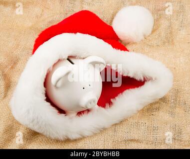 Sparschwein, die Bewachung des Weihnachtsmanns Krise budget Stockfoto