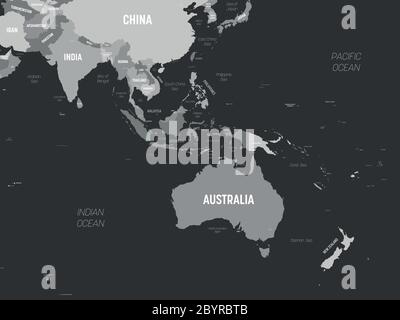 Australien und Südostasien Karte - grau gefärbt auf dunklem Hintergrund. Detaillierte politische Karte der australischen und südöstlichen Asien-Region mit Land-, Kapital-, Meer- und Meeresnamen. Stock Vektor