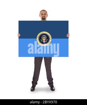 Geschäftsmann hielt eine große Karte Stockfoto