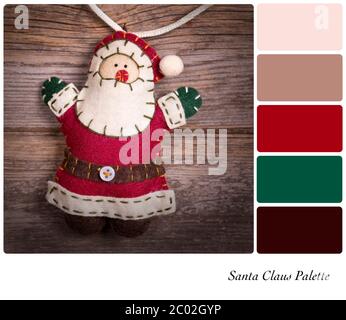 Retro-Stil fühlte Weihnachtsmann über altem Holz Hintergrund. In einer Farbpalette mit kostenlosen Farbfeldern. Stockfoto