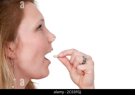 Frau Einnahme Pille Stockfoto