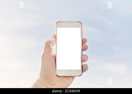 Ein Mann Hände halten Smartphone mit leerem Kopieplatz Bildschirm Stockfoto