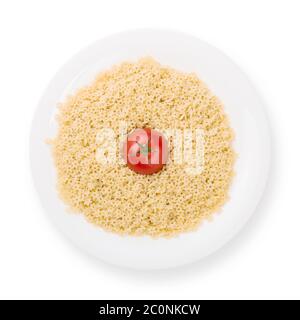 Teller mit Nudeln mit Tomaten von oben isoliert Stockfoto