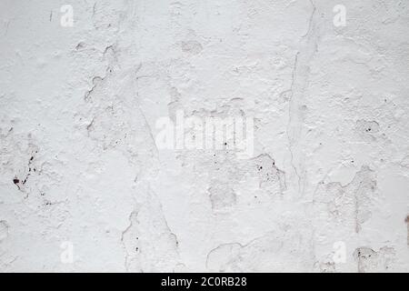 Alte weiße verputzte Wand aus nächster Nähe Stockfoto