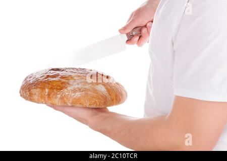 Bäcker schneiden frisches Brot. Stockfoto