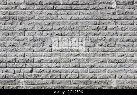 Die moderne Wand der grauen Betonfliesen Steinimitate. Stockfoto