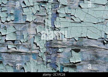 Strukturierter Hintergrund geknackt blaue Farbe auf einer Holzoberfläche Stockfoto
