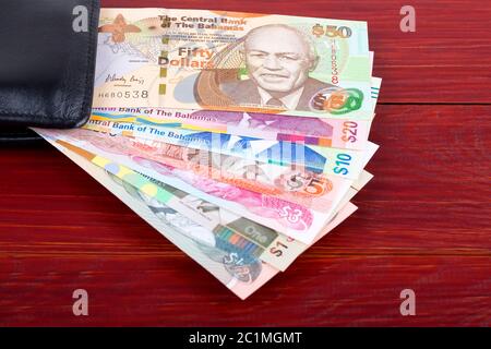 Bahamian Dollar im schwarzen Mappe Stockfoto